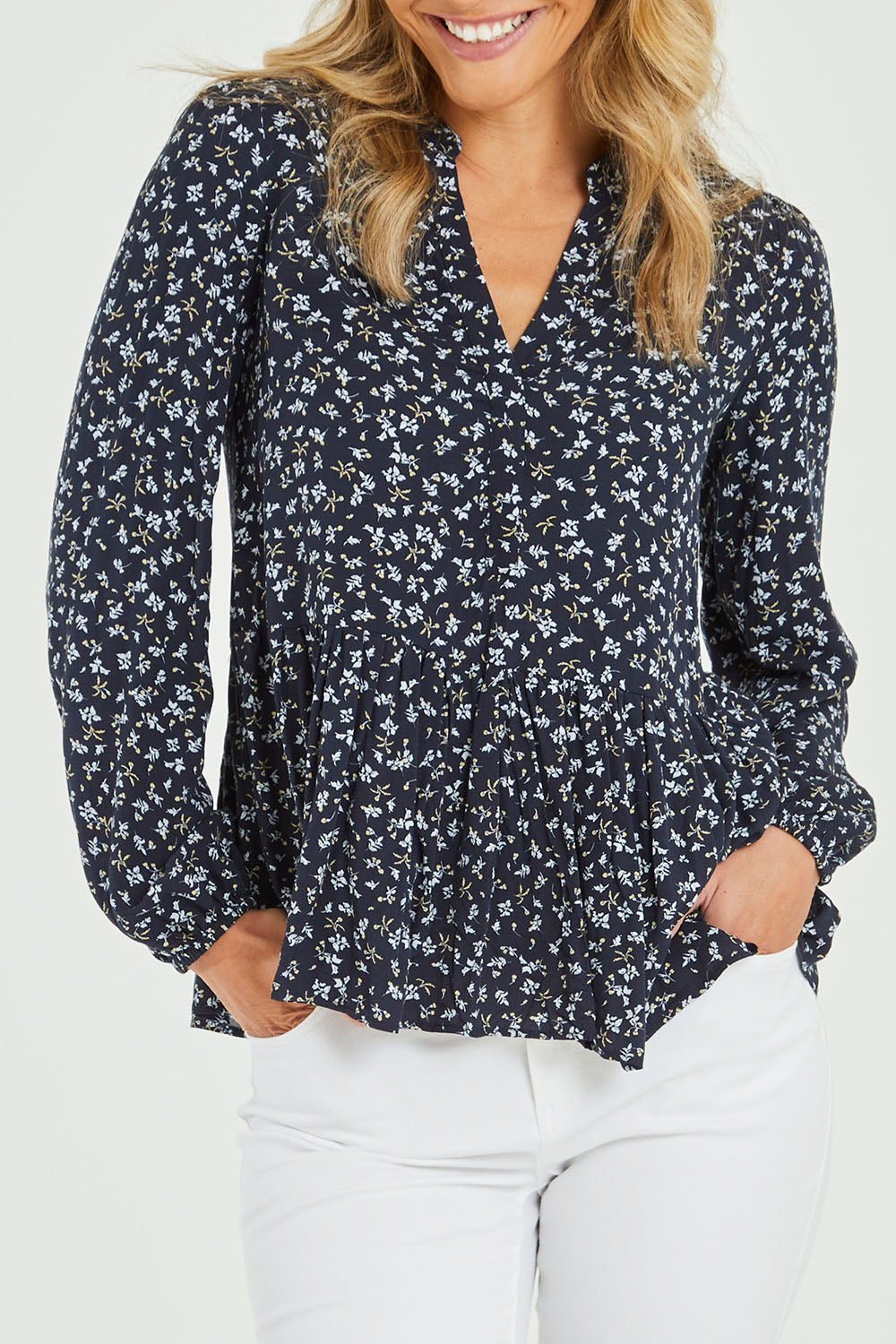 Model Alice wearing size 10 of the Lexton Blouse in colour Floral (Black), from the front, cropped image