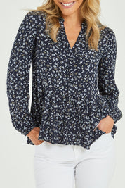 Model Alice wearing size 10 of the Lexton Blouse in colour Floral (Black), from the front, cropped image