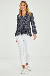 Model Alice wearing size 10 of the Lexton Blouse in colour Floral (Black), from the front, showing the whole outfit