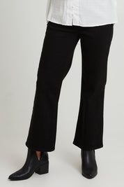 Model Katie wearing size 10 of the Nicola Bootleg Jean in colour Black (Black), from the front, cropped image