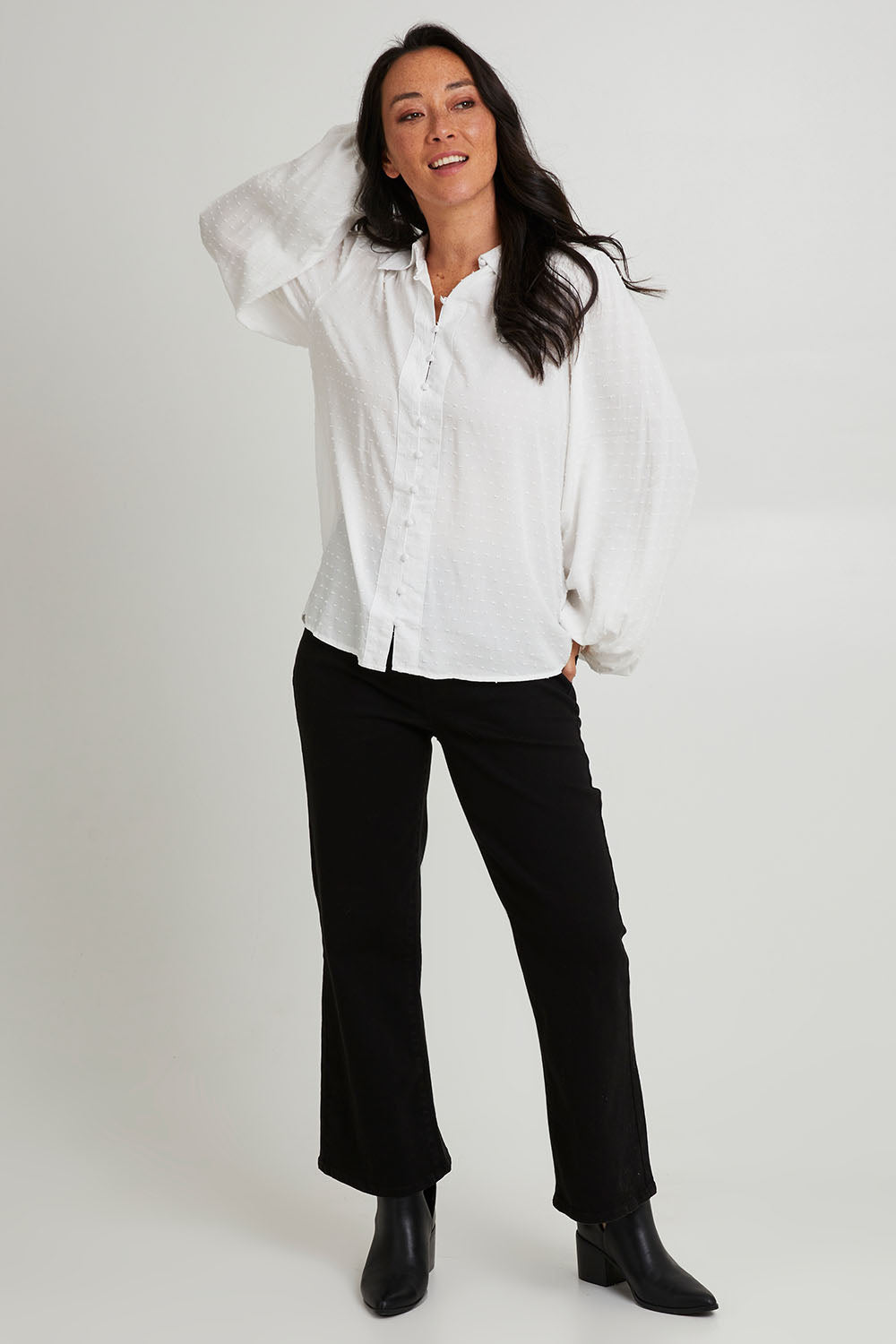 Model Katie wearing size 10 of the Nicola Bootleg Jean in colour Black (Black), from the front, showing the whole outfit