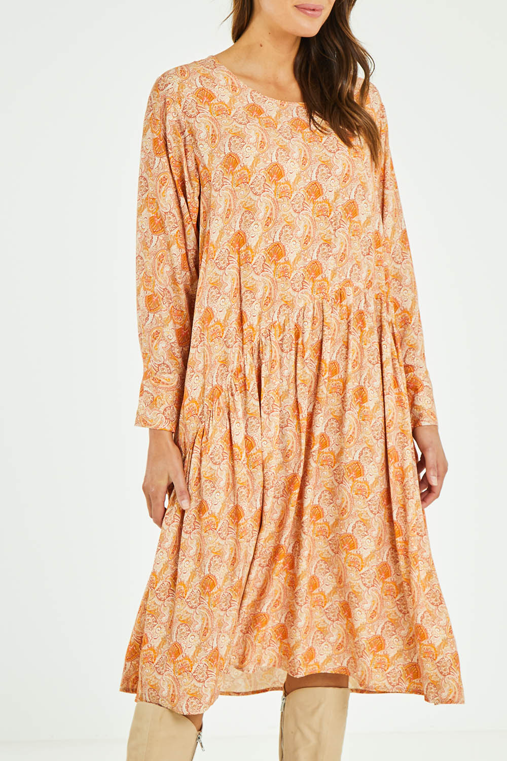 Model Madeline wearing size 10 of the Sharni Dress in colour Bohemian, from the front, cropped image