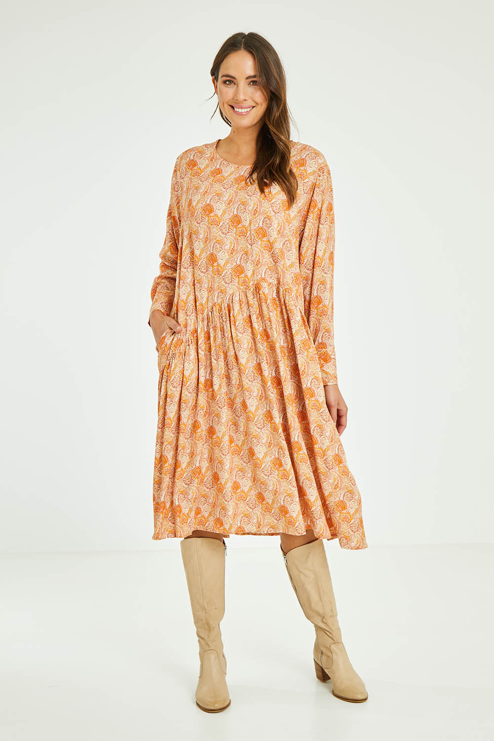 Model Madeline wearing size 10 of the Sharni Dress in colour Bohemian, from the front, showing the whole outfit