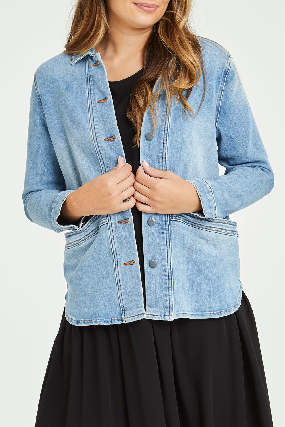 Model Tahlia wearing size 10 of the Reese Denim Shacket in colour Denim (Blue), from the front, cropped image