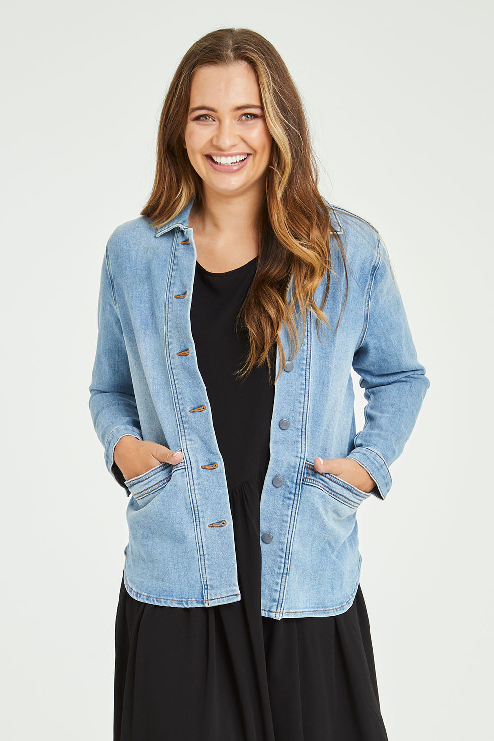 Model Tahlia wearing size 10 of the Reese Denim Shacket in colour Denim (Blue), from the front, cropped image