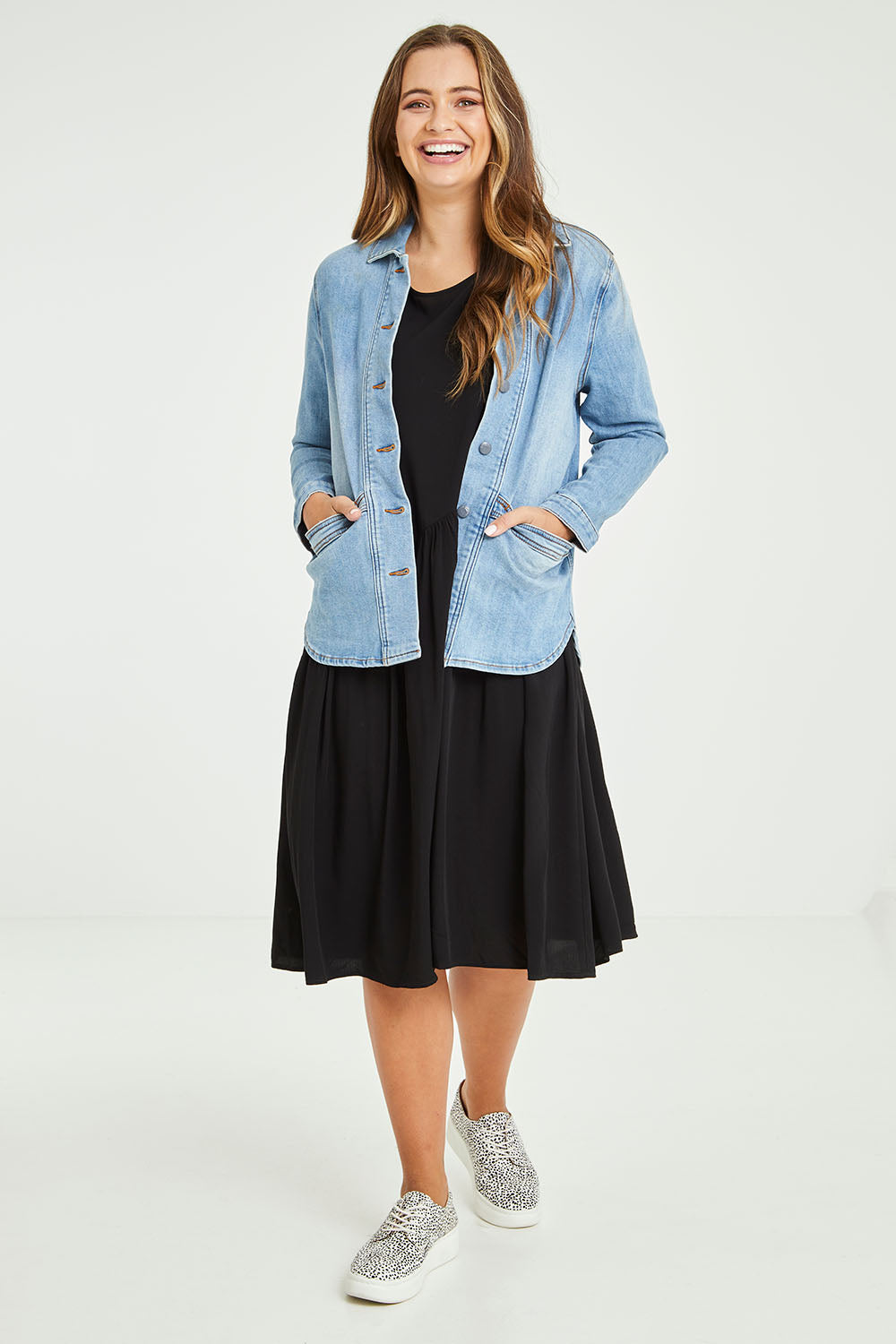 Model Tahlia wearing size 10 of the Reese Denim Shacket in colour Denim (Blue), from the front, showing the whole outfit