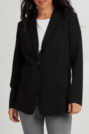 Model Katie wearing size 10 of the Portsea Blazer in colour Black (Black), from the front, cropped image