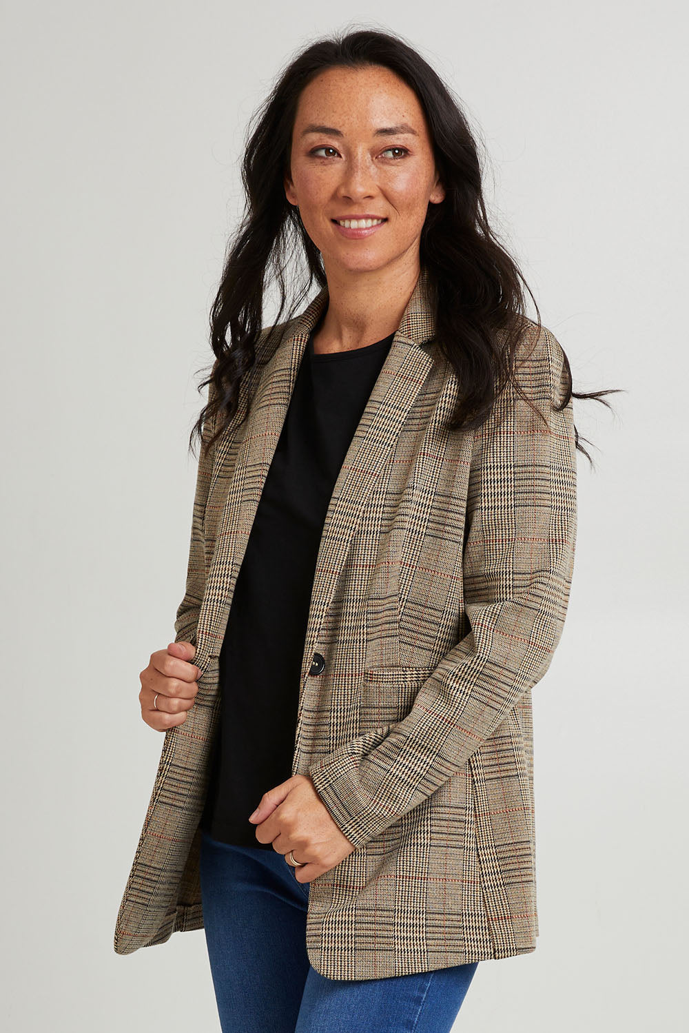 Model Katie wearing size 10 of the Portsea Blazer in colour Mochaplaid, from the front, cropped image