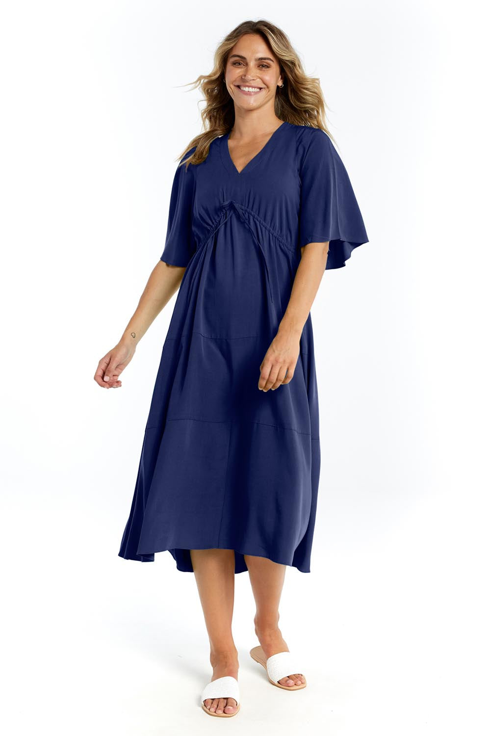 A model wearing the Cora Cotton Dress in colour Frenchblue (Blue), from the front, showing the whole outfit