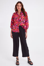 Model Madeline wearing size 10 of the Sarah Pant in colour Black (Black), from the front, showing the whole outfit