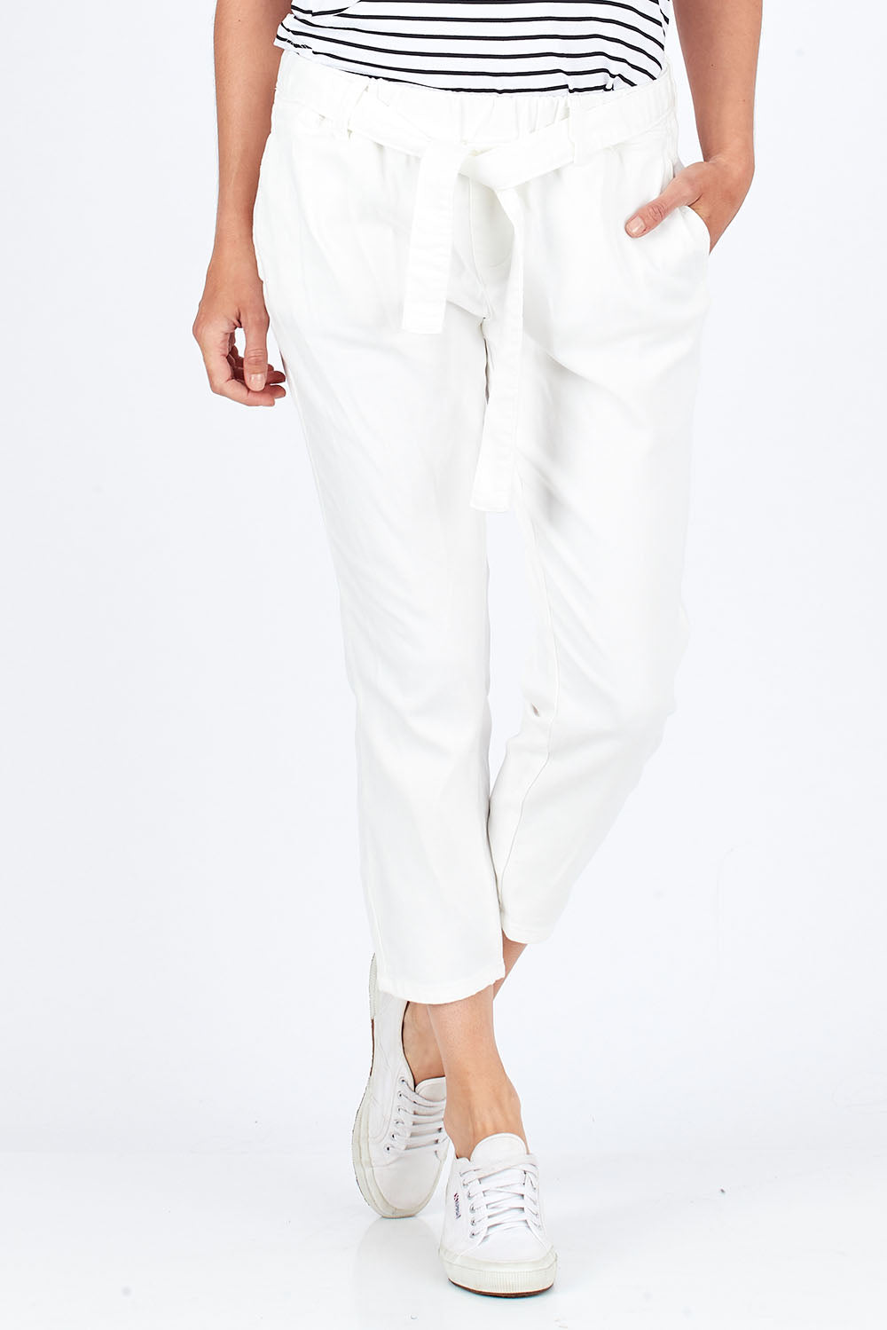Model Rebecca wearing size 10 of the Jude Stretch Denim Pant in colour White (White), from the front, cropped image