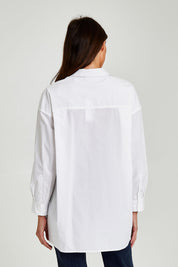 Model Madeline wearing size 10 of the Cleo Shirt in colour White (White), from the back