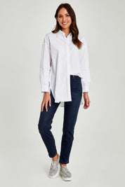 Model Madeline wearing size 10 of the Cleo Shirt in colour White (White), from the front, showing the whole outfit