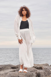 A model wearing the Renae Wide Leg Pants in colour White (White), from the front, showing the whole outfit