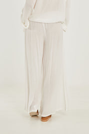 Model Georgia wearing size 10 of the Renae Wide Leg Pants in colour White (White), from the back