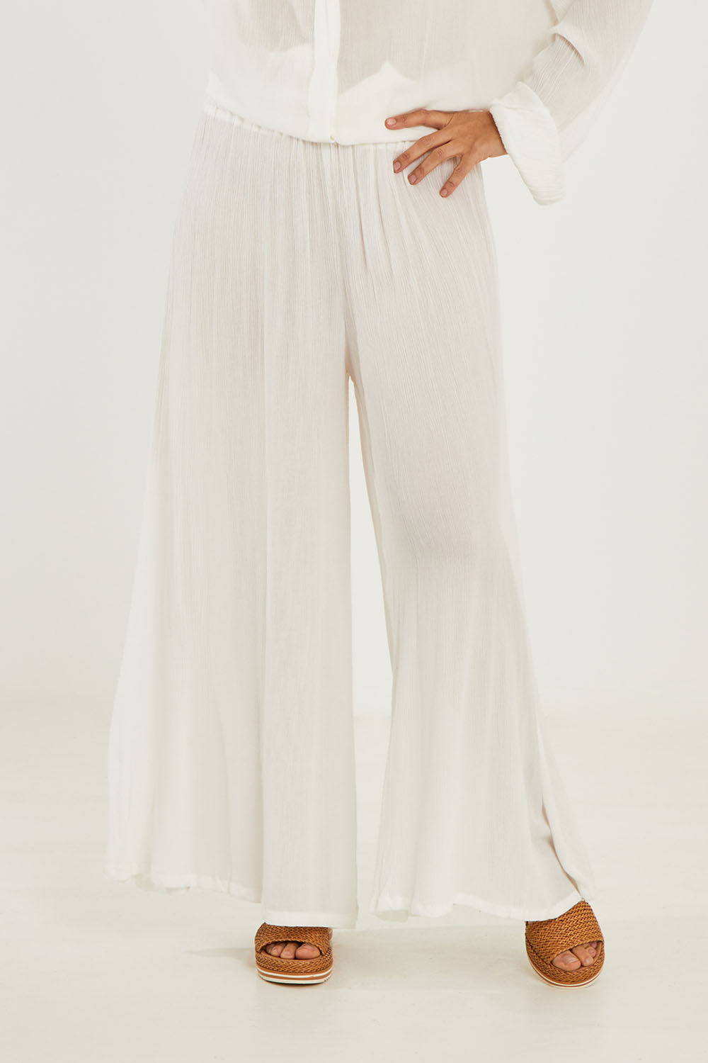 Model Georgia wearing size 10 of the Renae Wide Leg Pants in colour White (White), from the front, cropped image