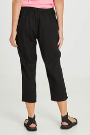 Model Madeline wearing size 10 of the Positano Linen Pant in colour Black (Black), from the back
