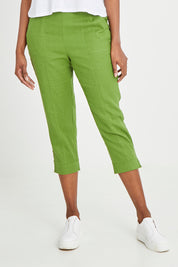 Model Aiyana wearing size 10 of the Positano Linen Pant in colour Lemongrass (Green), from the front, cropped image