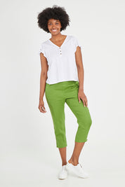 Model Aiyana wearing size 10 of the Positano Linen Pant in colour Lemongrass (Green), from the front, showing the whole outfit