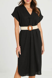 Model Madeline wearing size S of the Roma Linen Dress in colour Black (Black), from the front, cropped image