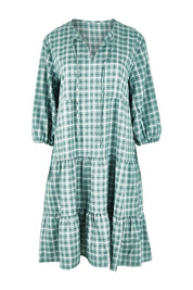 Product shot of the Odette Dress in colour Greenging (Green), from the front