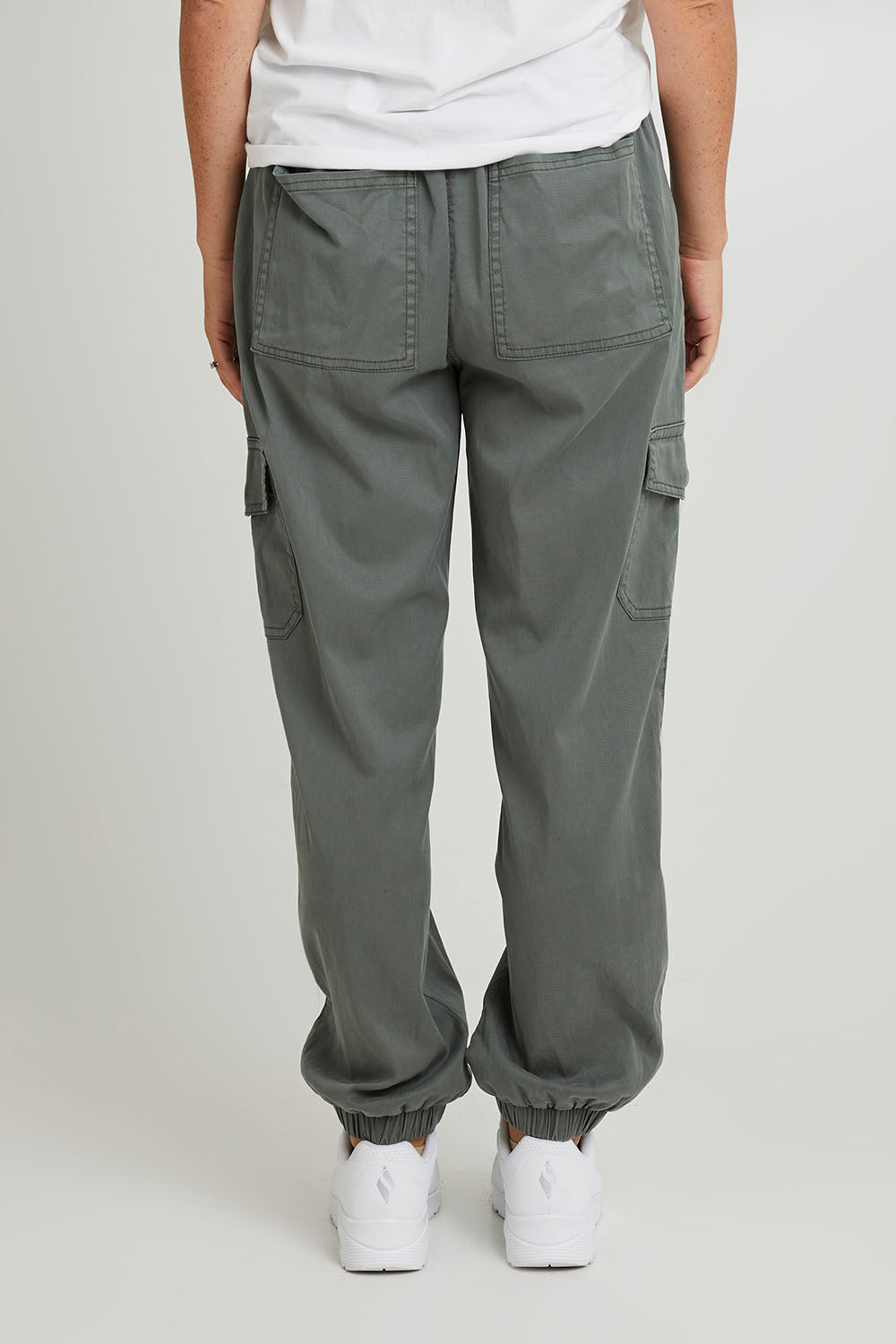 Model Katie wearing size 10 of the Canterbury Lyocell Cargo Pants in colour Khaki (Green), from the back