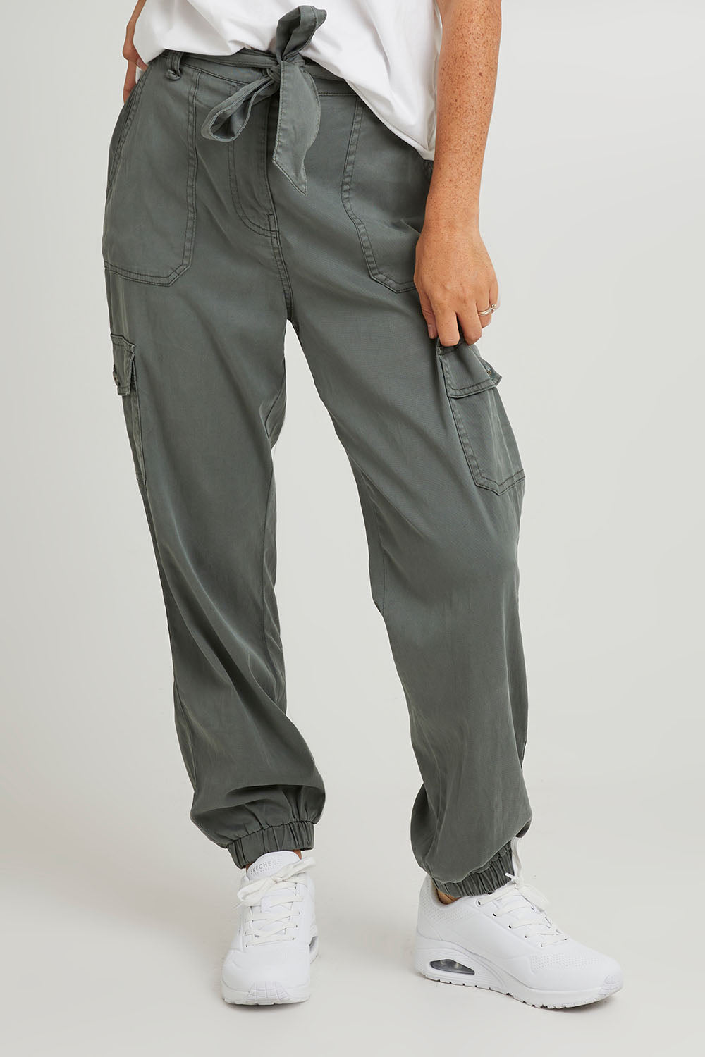 Model Katie wearing size 10 of the Canterbury Lyocell Cargo Pants in colour Khaki (Green), from the front, cropped image
