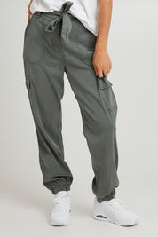 Model Katie wearing size 10 of the Canterbury Lyocell Cargo Pants in colour Khaki (Green), from the front, cropped image