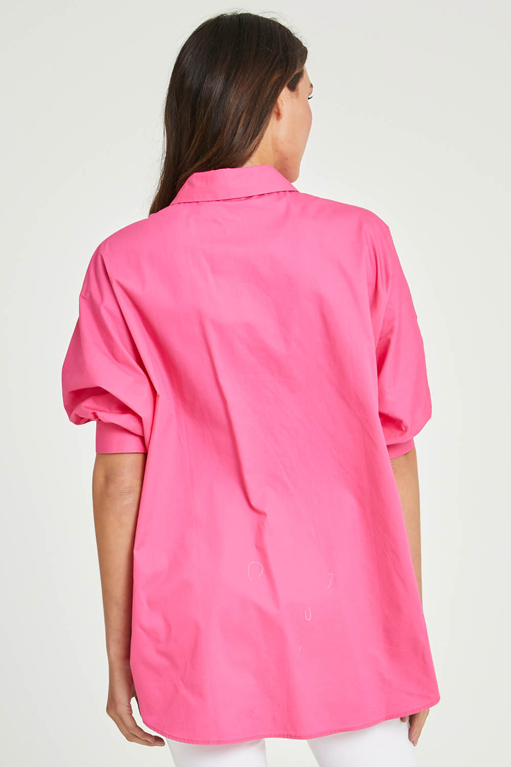 Model Madeline wearing size S of the Dolce Dolman Shirt in colour Pink (Pink), from the back