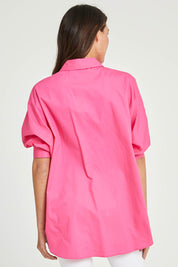 Model Madeline wearing size S of the Dolce Dolman Shirt in colour Pink (Pink), from the back