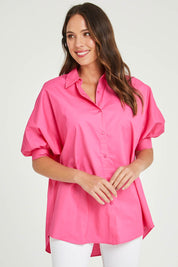 Model Madeline wearing size S of the Dolce Dolman Shirt in colour Pink (Pink), from the front, cropped image