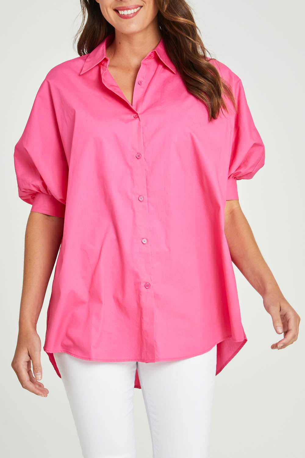 Model Madeline wearing size S of the Dolce Dolman Shirt in colour Pink (Pink), from the front, cropped image