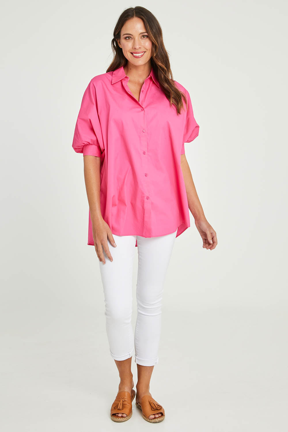 Model Madeline wearing size S of the Dolce Dolman Shirt in colour Pink (Pink), from the front, showing the whole outfit