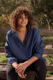 A model wearing the Carmen Pop Over Shirt in colour Darkdenim (Blue), from the front, showing the whole outfit