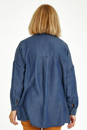 Model Sandy wearing size 10 of the Carmen Pop Over Shirt in colour Darkdenim (Blue), from the back
