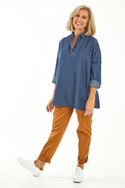 Model Sandy wearing size 10 of the Carmen Pop Over Shirt in colour Darkdenim (Blue), from the front, showing the whole outfit