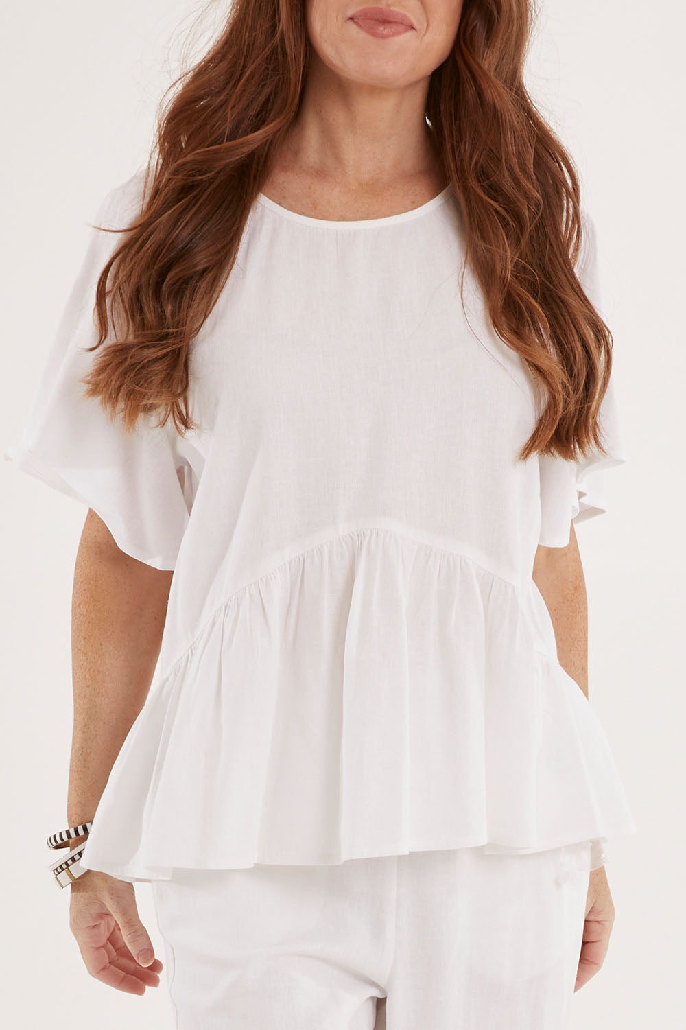 Model Sally wearing size 10 of the Cassandra Top in colour White (White), from the front, cropped image