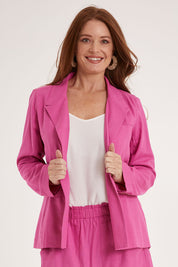 Model Sally wearing size 10 of the Lisset Blazer in colour Azalea (Pink), from the front, cropped image