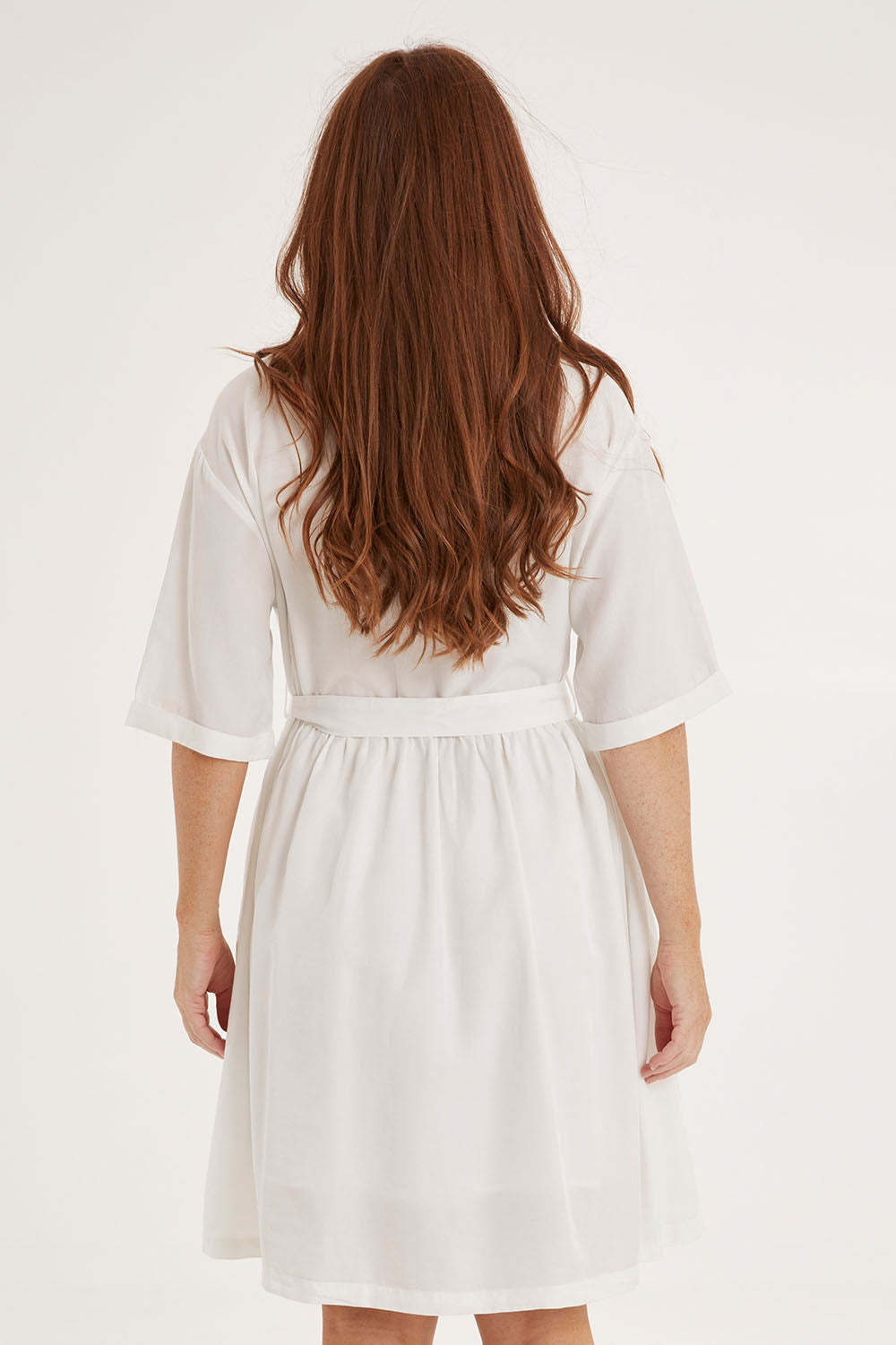 Model Sally wearing size 10 of the Miley Lyocell Shirt Dress in colour White (White), from the back