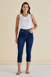 A model wearing the Camila Crop Jeans in colour Midnight (Blue), from the front, showing the whole outfit