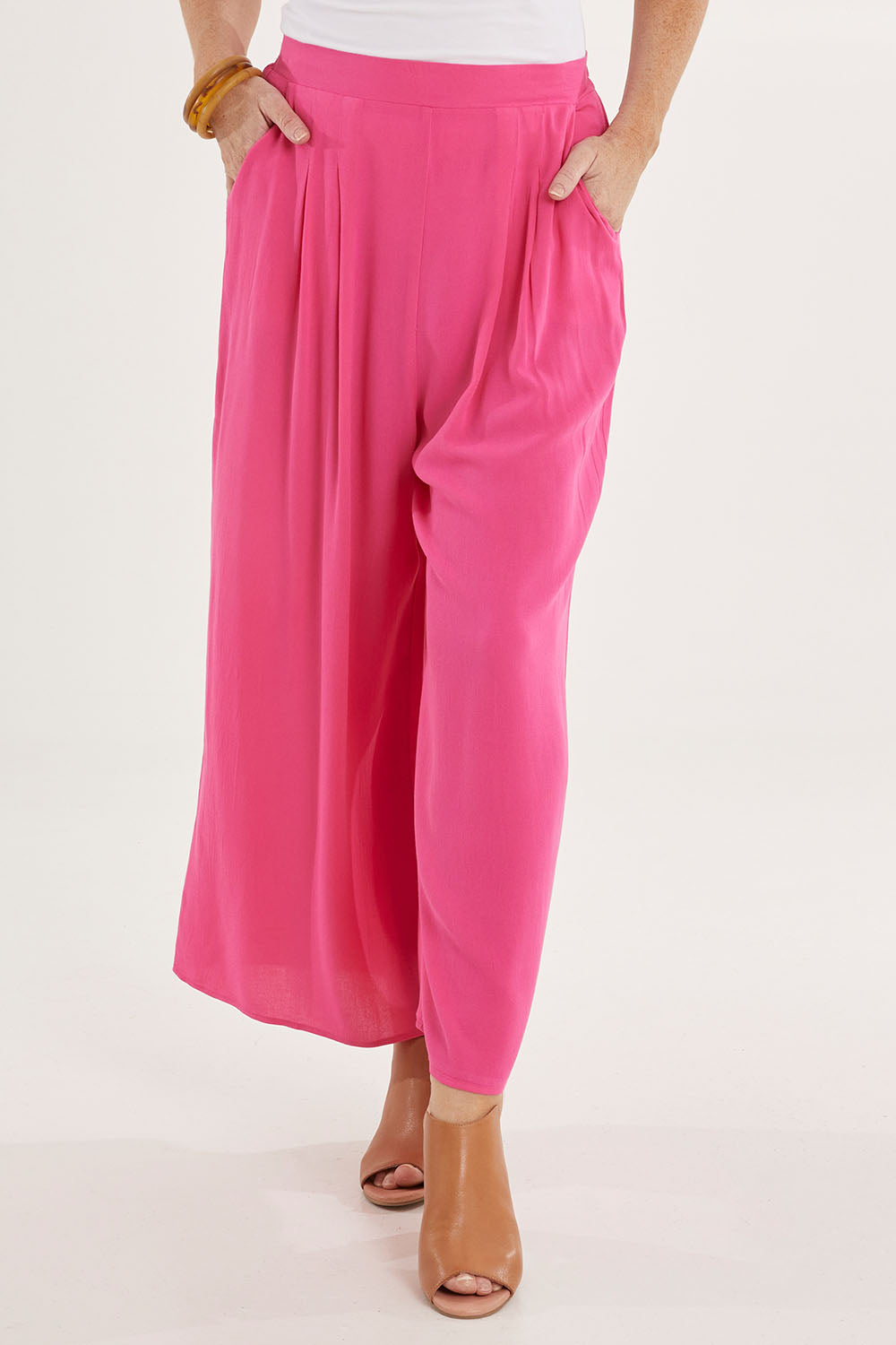 Model Sally wearing size 10 of the Olympia Pant in colour Frenchrose (Pink), from the front, cropped image