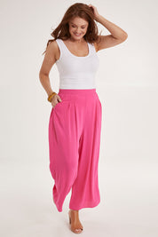 Model Sally wearing size 10 of the Olympia Pant in colour Frenchrose (Pink), from the front, showing the whole outfit