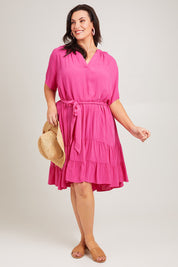 Model Poppy wearing size 16 of the Port Douglas Dress in colour Frenchrose (Pink), from the front, showing the whole outfit