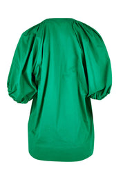 Product shot of the Juliet Blouse in colour Hollygreen (Green), from the back