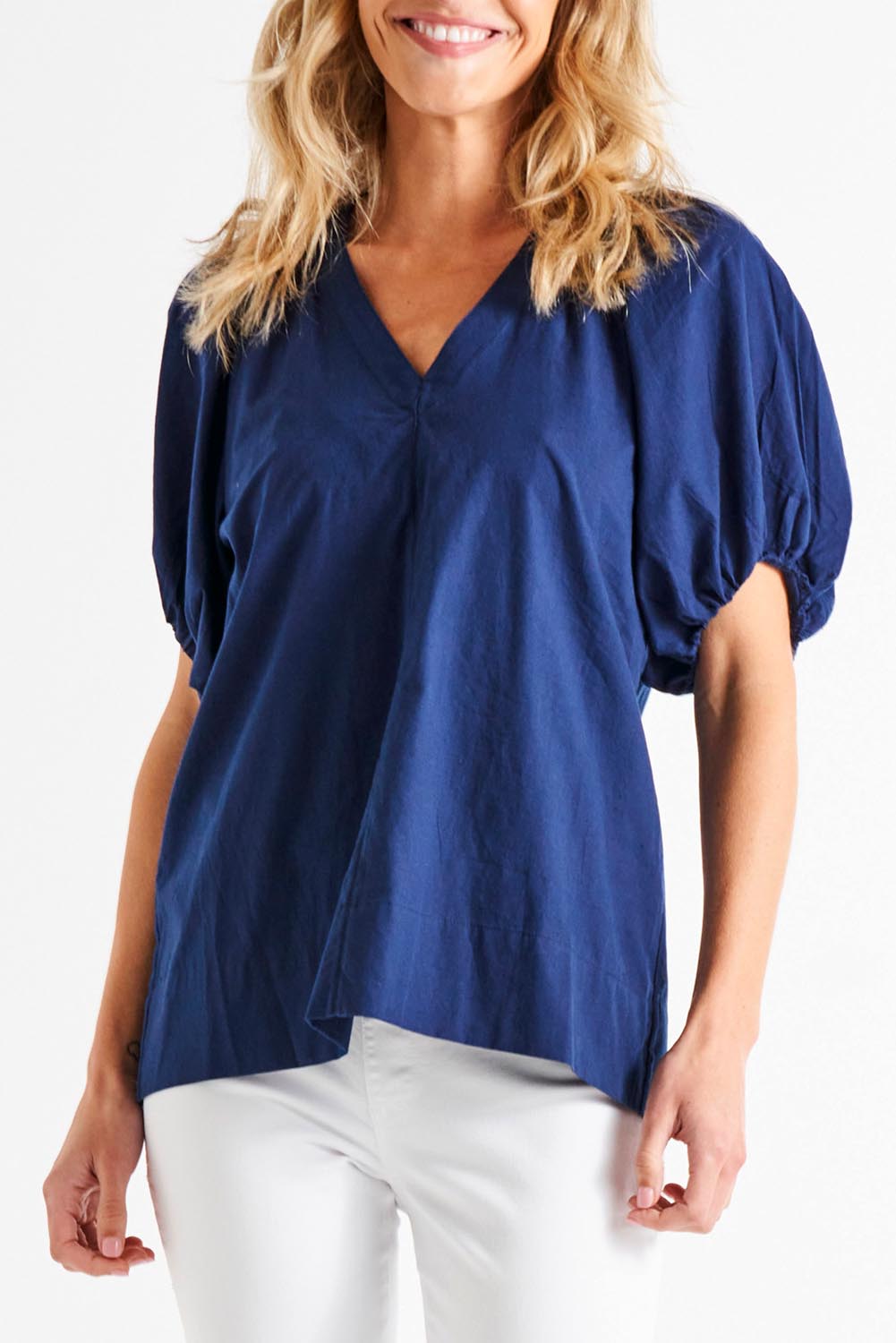 A model wearing the Juliet Blouse in colour Navy (Blue), from the front, cropped image