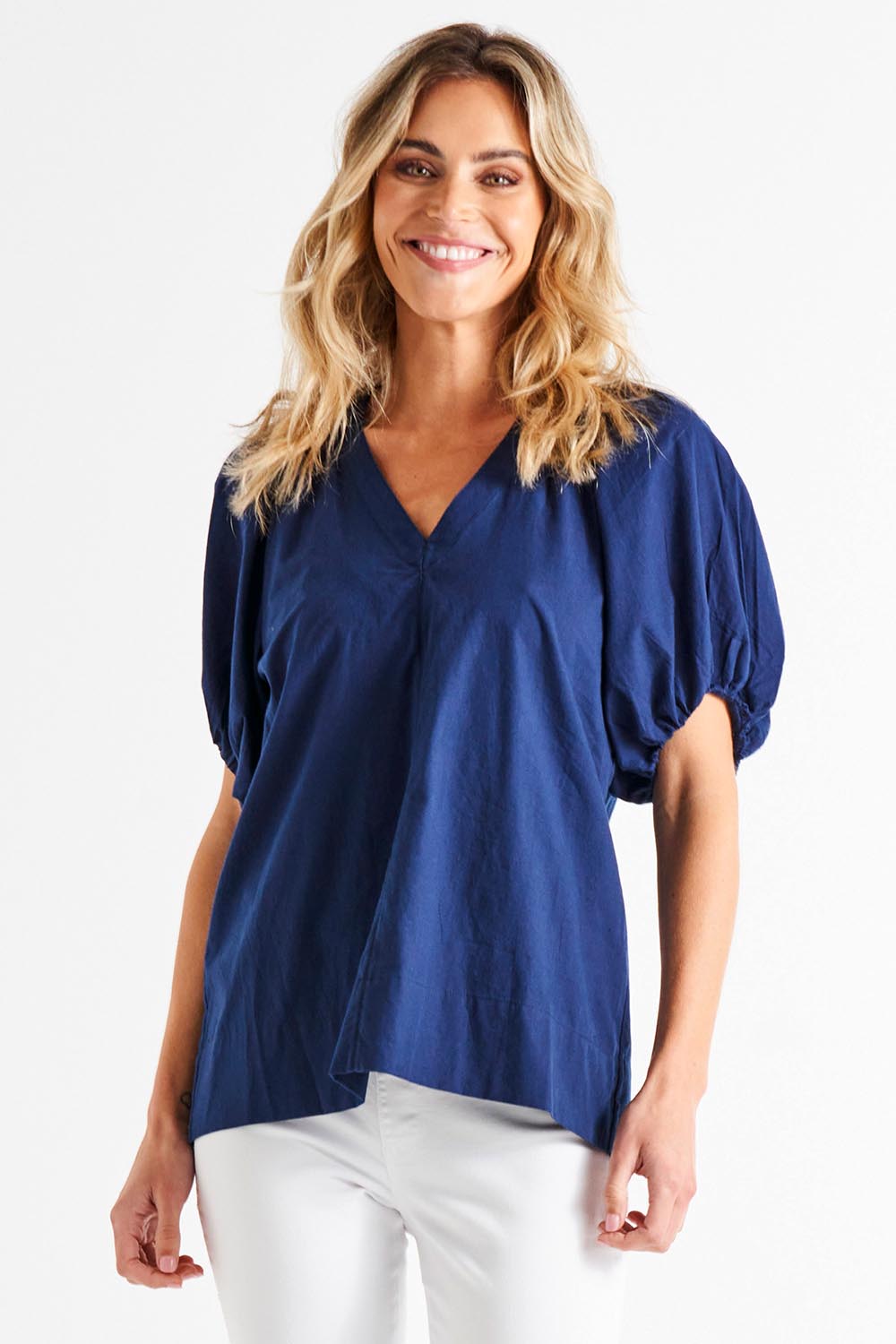 A model wearing the Juliet Blouse in colour Navy (Blue), from the front, cropped image
