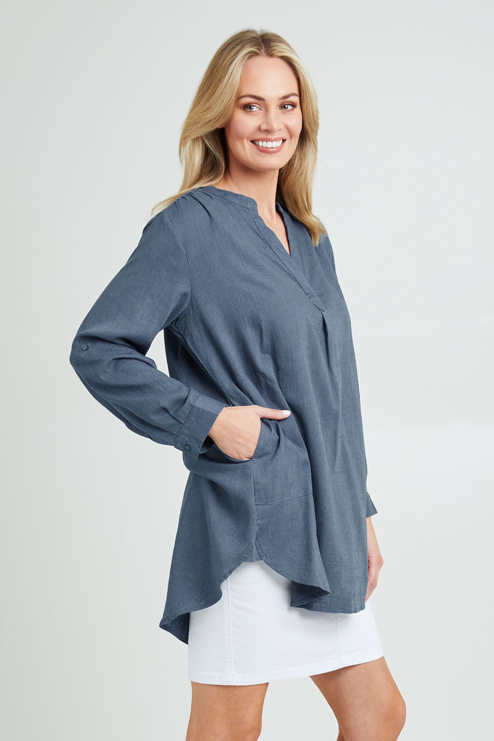 Model Grace wearing size 10 of the Beach Tunic Shirt in colour Blue (Blue), from the front, cropped image