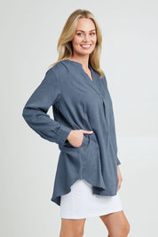 Model Grace wearing size 10 of the Beach Tunic Shirt in colour Blue (Blue), from the front, cropped image