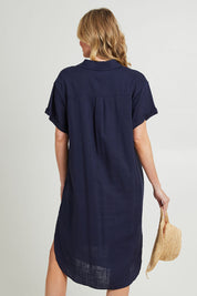 Model Grace wearing size 10 of the Lani Linen Shirt Dress in colour Navy (Blue), from the back