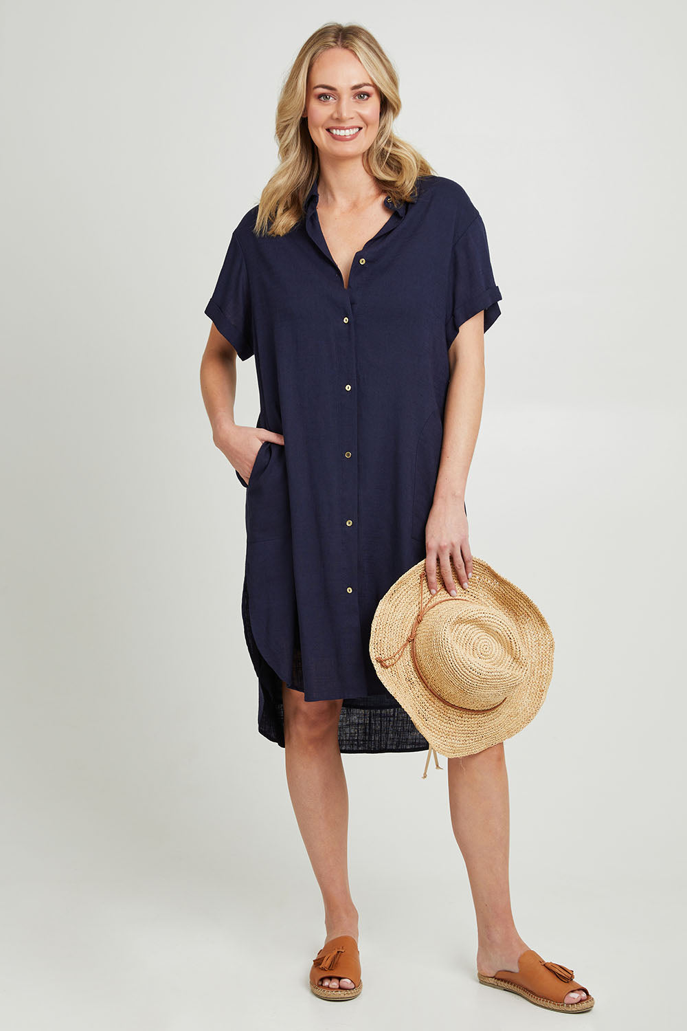 Model Grace wearing size 10 of the Lani Linen Shirt Dress in colour Navy (Blue), from the front, showing the whole outfit